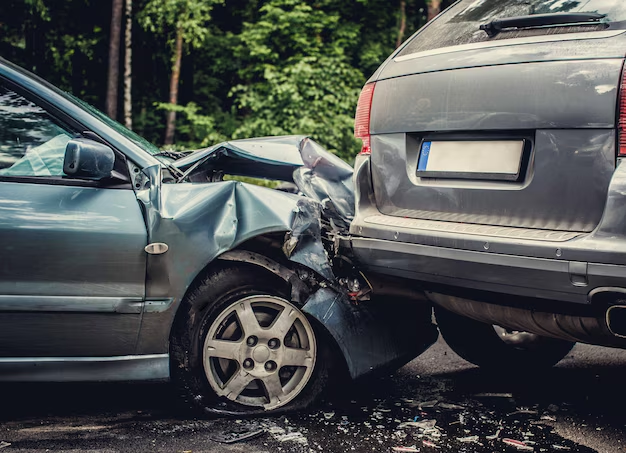Car with a crumpled front end after rear-ending an SUV