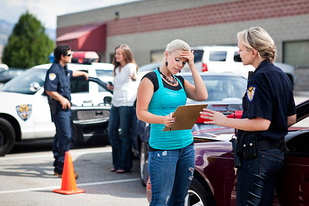 Police officer taking a report from an upset driver at an accident scene