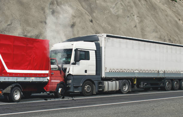 Semi-truck collided head-on with a red box truck on a highway